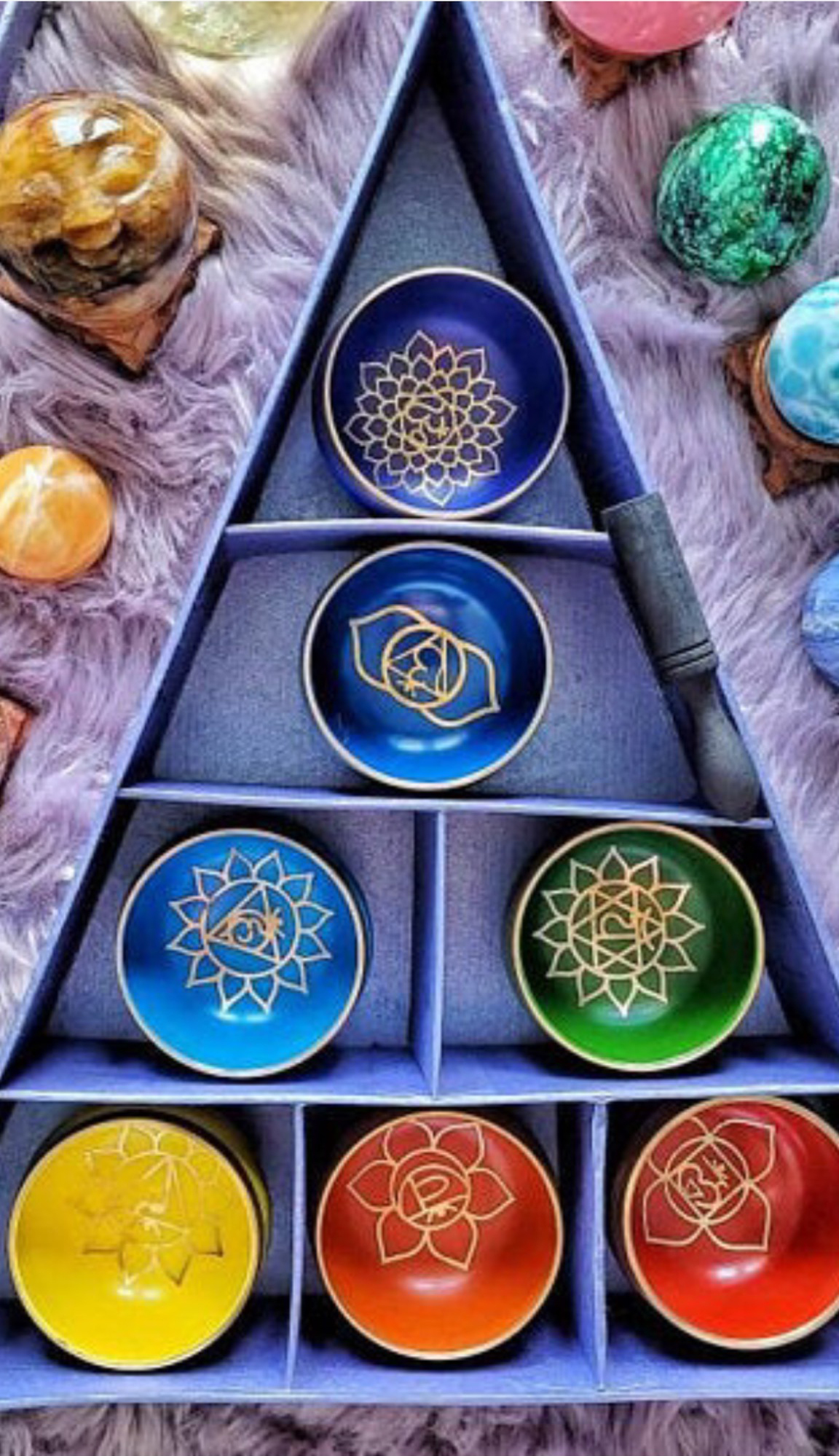 Singing chakra bowls in chakra colors represent Spiritual Healing